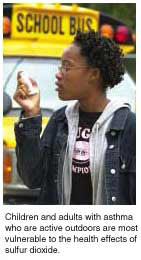 A female student with an inhaler.
