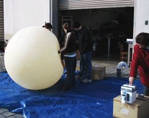 Students prepare to launch weather balloon with ozonesonde package from roof of Walker Building, Penn State, University Park, PA