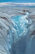 MELTWATER FLOWING INTO A MOULIN