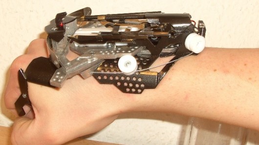 Hobbyist Patrick Priebe's latest creation is a wrist-mounted laser-sighted mini crossbow