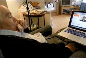 Prof. Martin Fleischmann, at home in England, watching Prof. Josephson’s video about the Rossi E-Cat technology, June 27, 2011. (Photo by Marianne Macy, Infinite Energy)