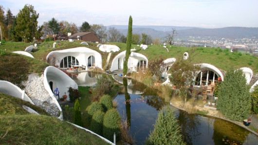 The Earth House Estate Lttenstrasse in Switzerland consists of several Hobbit Hole-style...